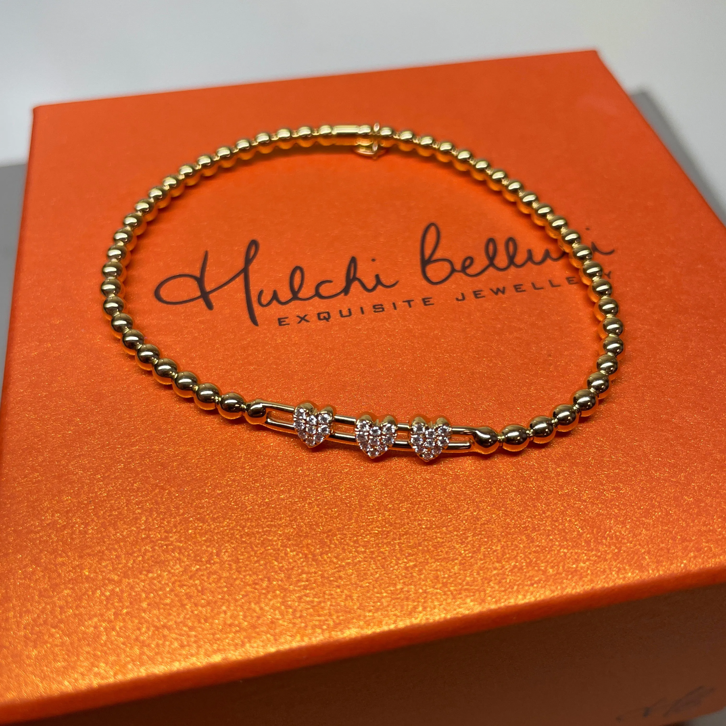 Hulchi Belluni Fidget Bracelet with Three Pave Diamond Moveable Heart Stations Yellow Gold Stretch Stackable