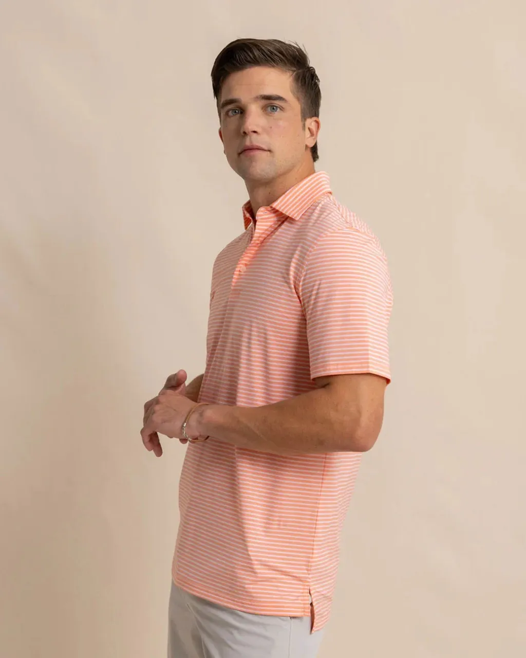 Southern Tide brrr°-eeze Beattie Stripe Performance Polo: Desert Flower Coral